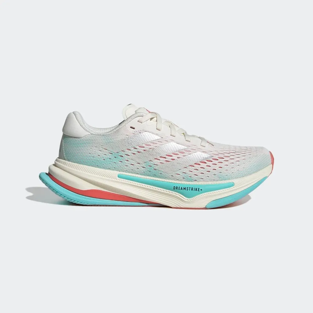 Women's Supernova Prima (OWHITE/SILVMT/FLAAQU) running in a Pilates studio shoes